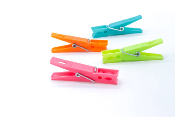 istock plastic clothespins with different colors like green, pink, blue, orange on white background 1408823928