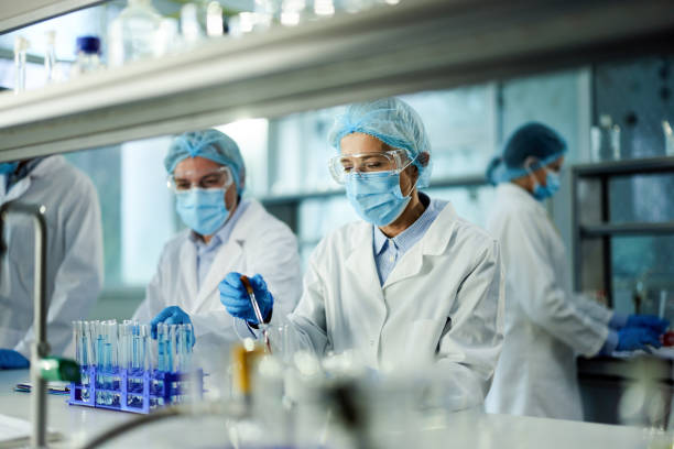 istock Mature scientist working on antiviral drug in laboratory. 1408826551