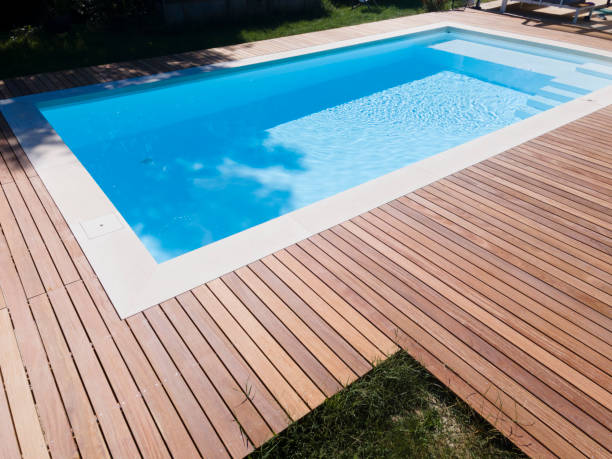 istock Drone flight over pool with beautiful wooden terrace 1408827924