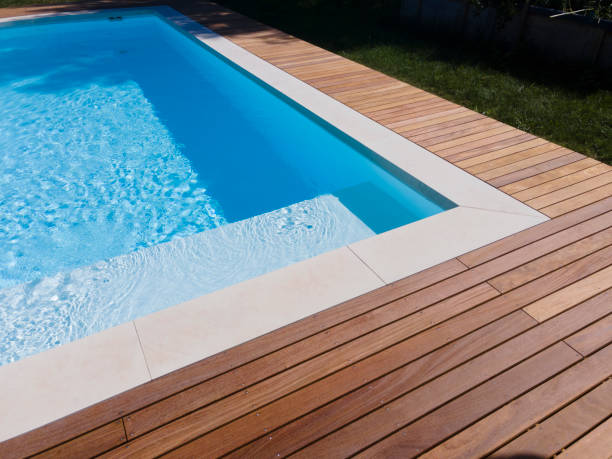 istock Drone flight over pool with beautiful wooden terrace 1408828925