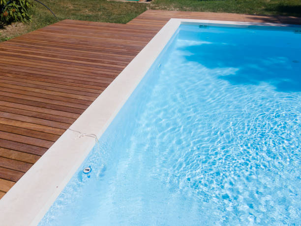istock Drone flight over pool with beautiful wooden terrace 1408828967