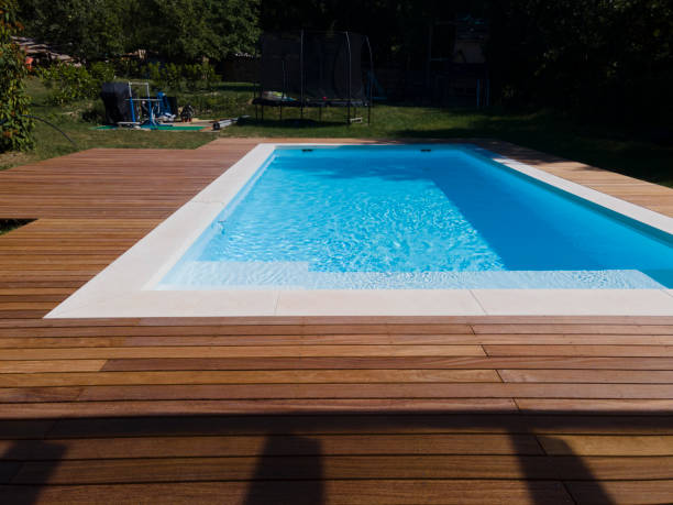 istock Drone flight over pool with beautiful wooden terrace 1408829469
