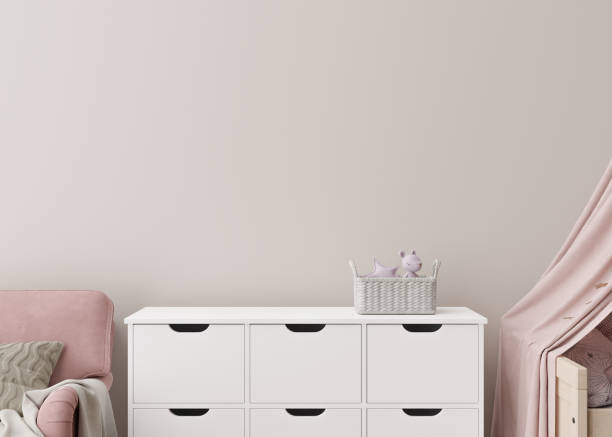 istock Empty cream wall in modern child room. Mock up interior in scandinavian style. Copy space for your picture or poster. Sideboard, toys. Close up view. Cozy room for kids. 3D rendering. 1408832649