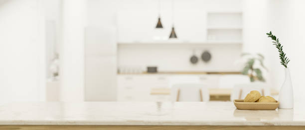 istock Modern kitchen tabletop with copy space over blurred modern bright kitchen in the background 1408832651