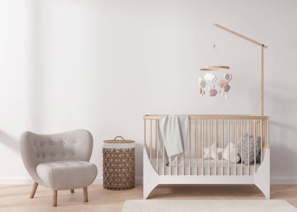 istock Empty white wall in modern child room. Mock up interior in scandinavian style. Copy space for your picture or poster. Bed, armchair, rattan basket. Cozy room for kids. 3D rendering. 1408832668