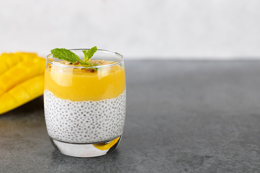 Chia seed pudding, mango puree, coconut milk. The concept of healthy breakfast, vegan, raw food desserts without sugar.