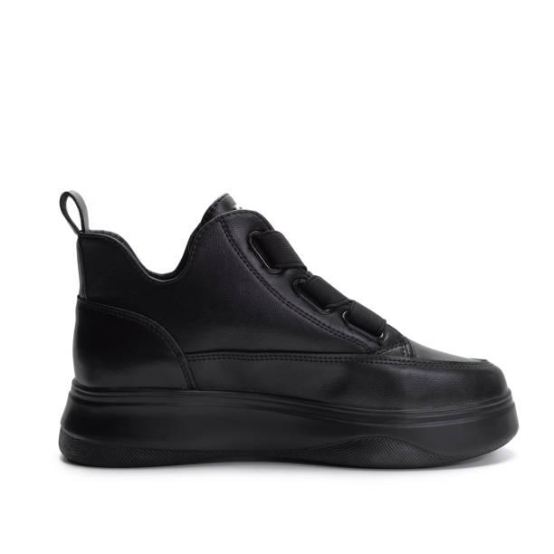 istock Black shoes on gray and white background 1408838089