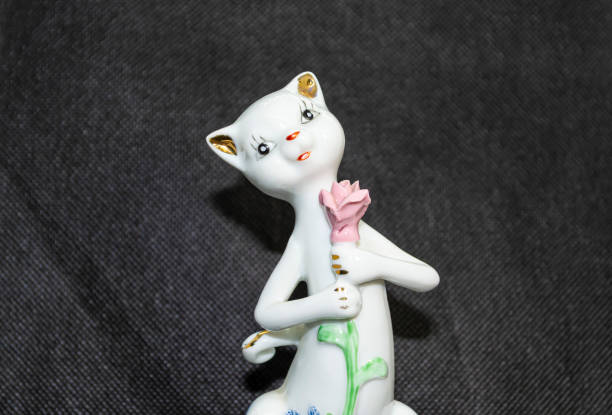 Close-up of a Maneki-neko (beckoning cat) placed near the entrance.
