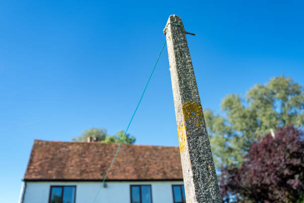 Shallow focus of a concrete clothes line post showing its rough texture