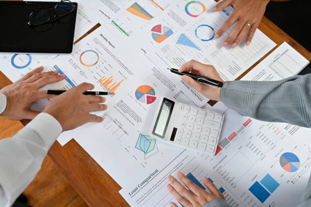 istock Above view, A professional financial analysts team having a financial project meeting 1408841467