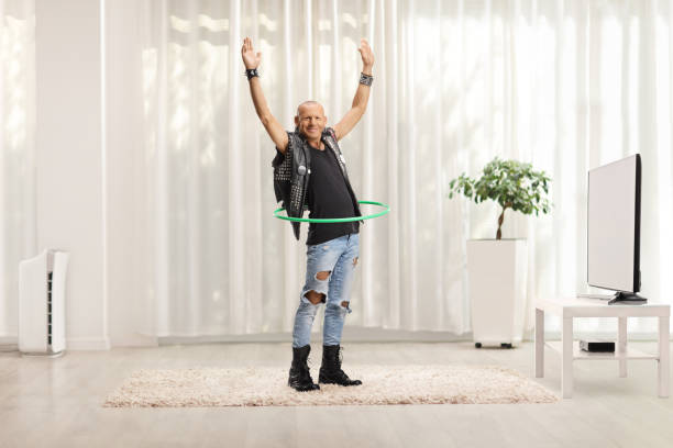 istock Punk spinning a hula hoop at home 1408842286