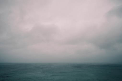 Moody overcast Seascape over Newquay Bay, Cornwall on a gloomy summer day.
