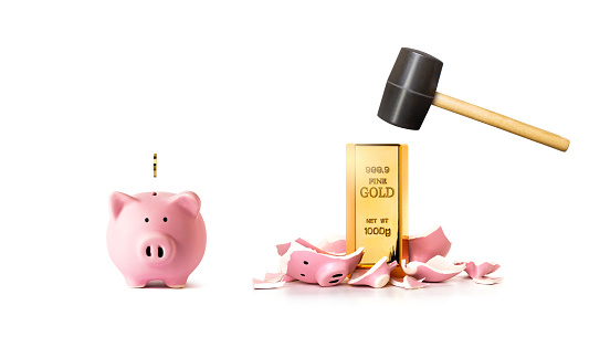 Piggy bank and gold bar