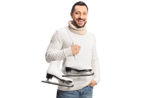 istock Guy carrying ice-skates on his shoulder and smiling 1408843745