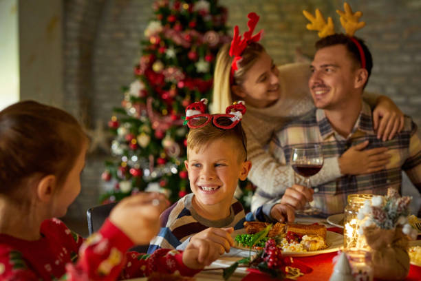 istock Family enjoying Christmas dinner at home 1408844742