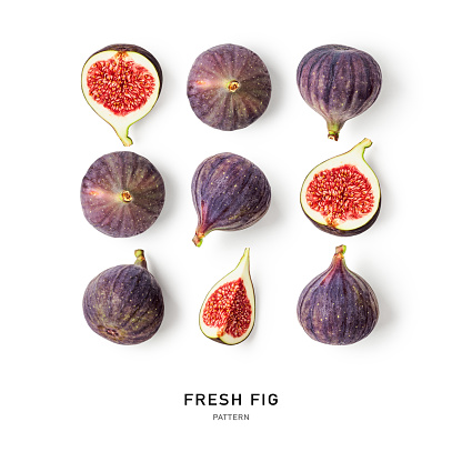 Fig fruit creative pattern isolated on white background. Healthy eating and dieting food concept. Tropical fruits and leaves composition and layout. Top view, flat lay. Design element