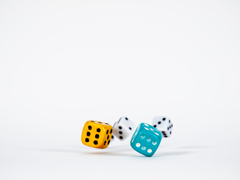 Rolling Old And Colored Dices