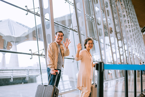 Parents say goodbye at the airport.
