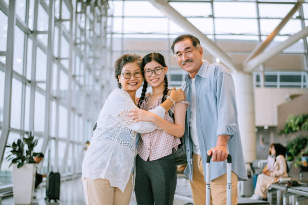 Family going on holiday and waiting at the airport stock photo