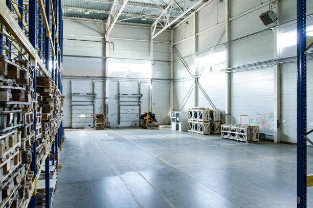 istock General view to the loading gates inside the warehouse.Interior of a modern warehouse storage. Truck loading process 1408851986