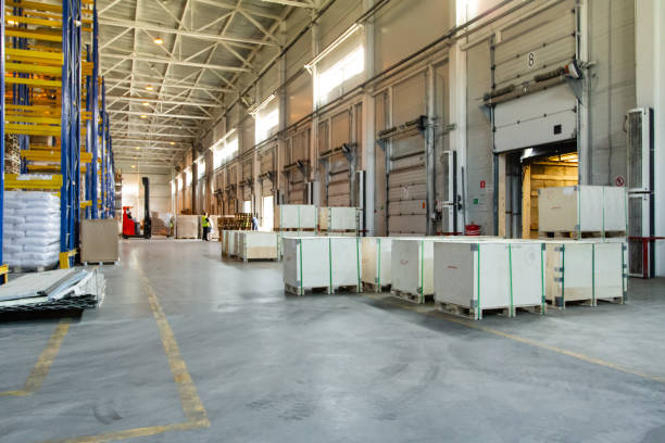 istock General view to the loading gates inside the warehouse.Interior of a modern warehouse storage. Truck loading process 1408852281