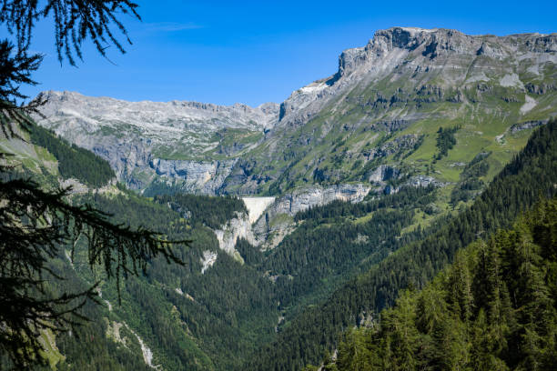 Beautiful view on Lac de Tseuzier and surrounding mountains close to Crans Montana Beautiful view on Lac de Tseuzier and surrounding mountains close to Crans Montana in Switzerland crans montana stock pictures, royalty-free photos & images