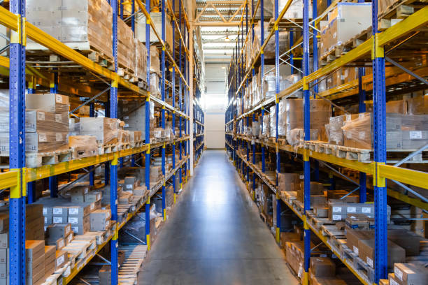 istock Interior of a modern warehouse storage with rows and goods boxes on high shelves 1408855019