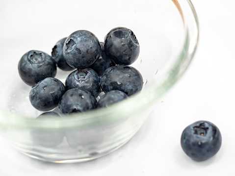 blueberries in glass bowl
