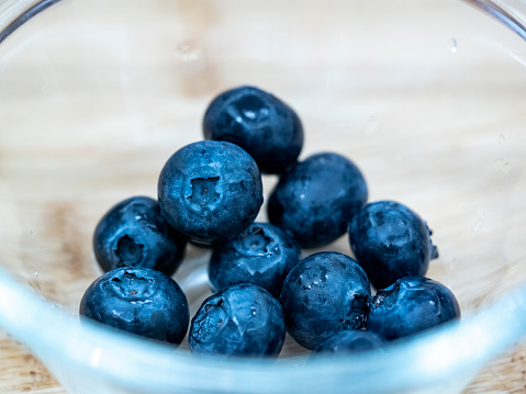 Close-up of blueberries in glass bowl