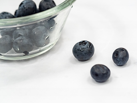 Close-up of blueberries in glass bowl