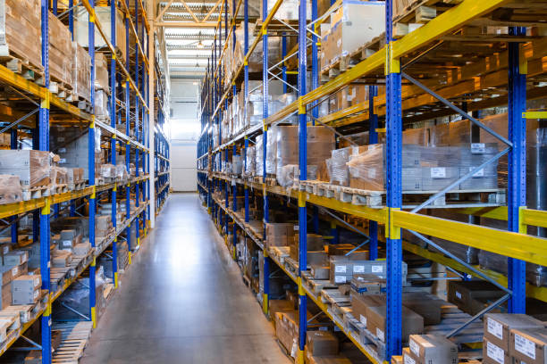 istock Interior of a modern warehouse storage with rows and goods boxes on high shelves 1408855420