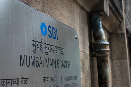 Mumbai, India - 25 September 2021, A board with logo, sign of State Bank of India Mumbai Main branch near Horniman Circle.  SBI is Indian multinational public sector banking and financial services.