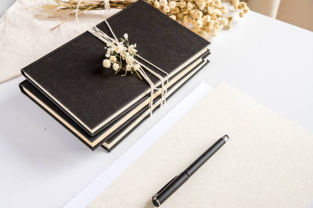 istock White table with some books, sheets and pen. Conceptual image, representation of creativity, knowledge and leisure. 1408857366
