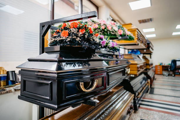 Shop selling coffins and funeral wreaths Shop selling coffins and funeral wreaths. Sale of funeral accessories. undertaker stock pictures, royalty-free photos & images