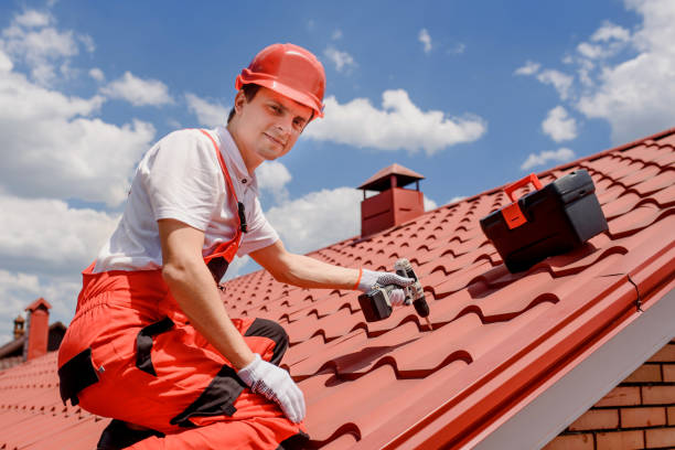 man worker master in red overall and helmet is fixing the metal tile roof. - roof tile architectural detail architecture and buildings built structure imagens e fotografias de stock