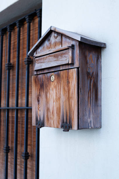 istock Wooden mailbox near the house 1408858376