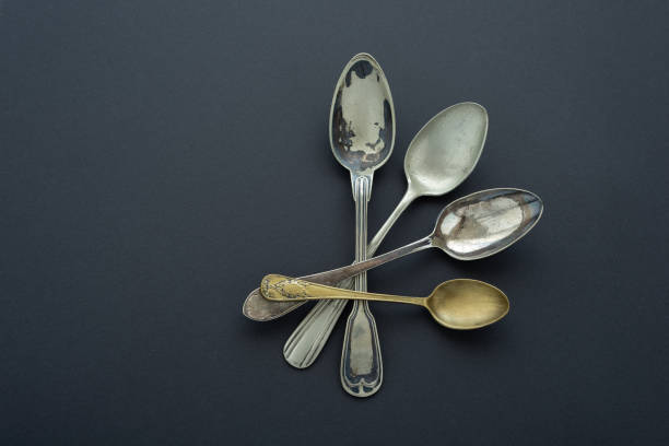 istock Composition of vintage spoons on black background. Flat lay. 1408860003
