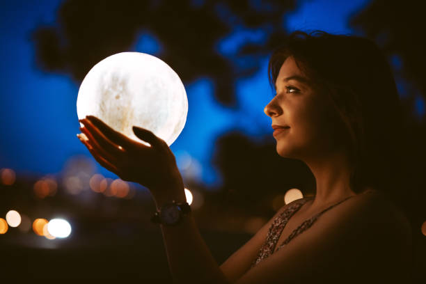 istock Young Woman With A Moon Light Lamp 1408861129