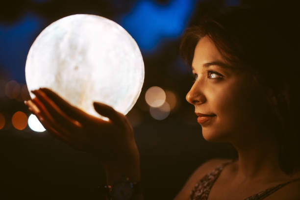 istock Young Woman With A Moon Light Lamp 1408861163