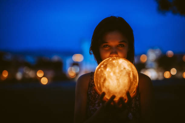 istock Young Woman With A Moon Light Lamp 1408861197