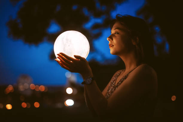 istock Young Woman With A Moon Light Lamp 1408861316