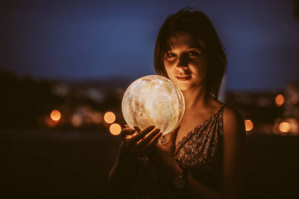 Young Woman With A Moon Light Lamp