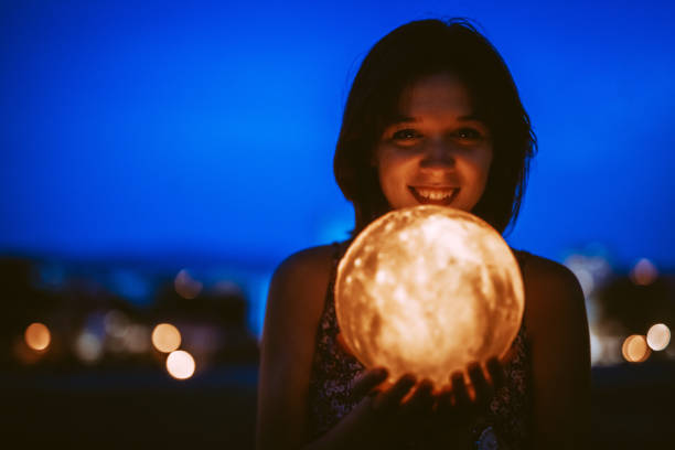 istock Young Woman With A Moon Light Lamp 1408861359