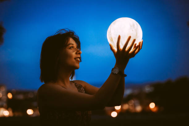 istock Young Woman With A Moon Light Lamp 1408861430