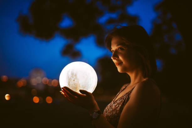 istock Young Woman With A Moon Light Lamp 1408861468