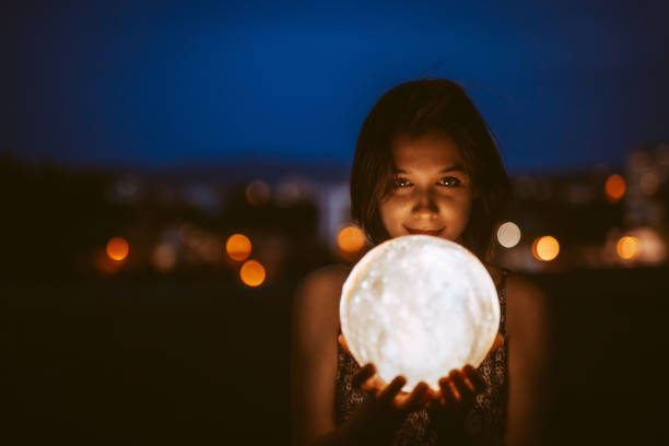 istock Young Woman With A Moon Light Lamp 1408861509
