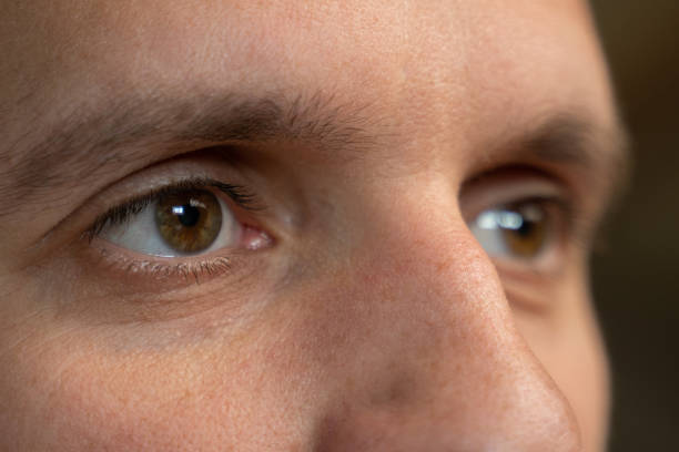 istock Extreme close-up of man eyes looking sideways 1408861791