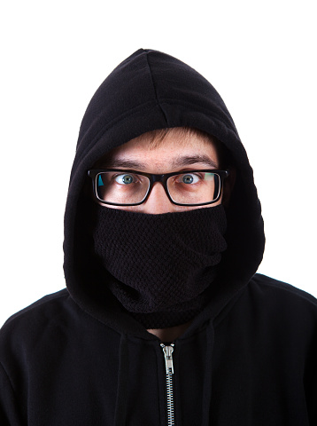 Man in a Hoodie hide Face with a Black Scarf Isolated and Closeup