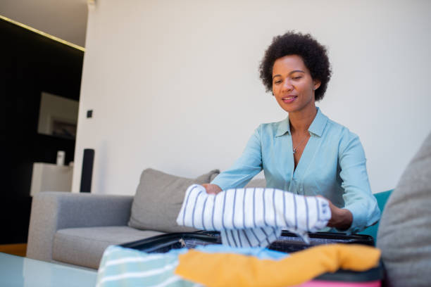 istock Woman organizing her luggage 1408862084