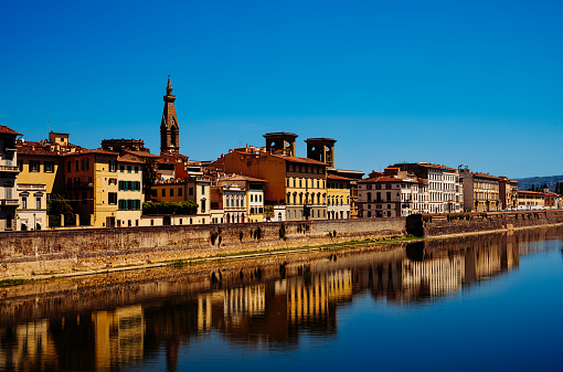 Looking east along the Arno River from the Ponte alle Grazie in Florence, Italy.